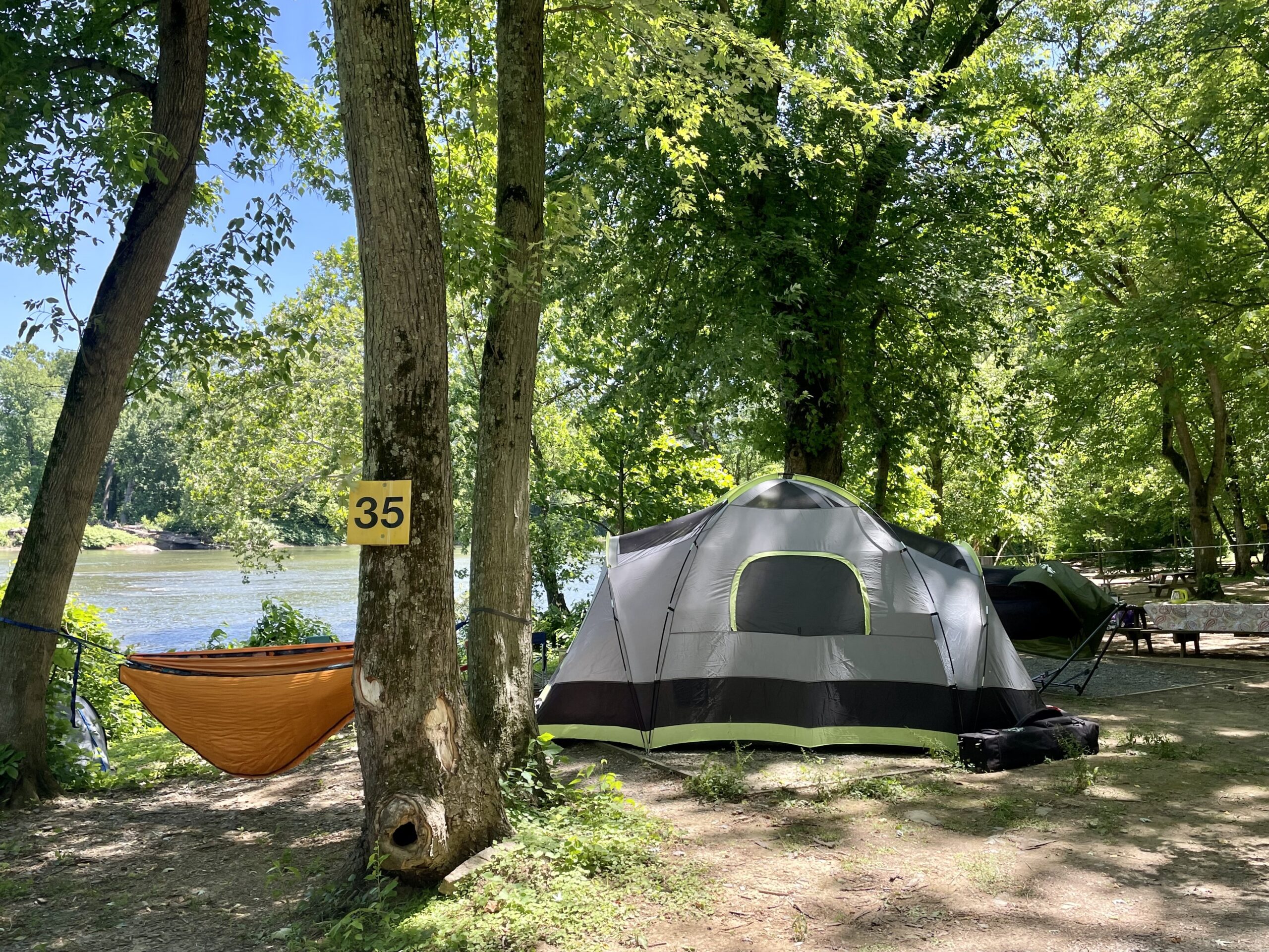 A riverside campsite at Harpers Ferry Adventure Center.